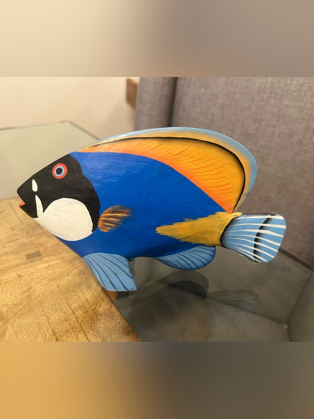 hand-carved and hand-painted wooden sculpture of a tropical reef fish